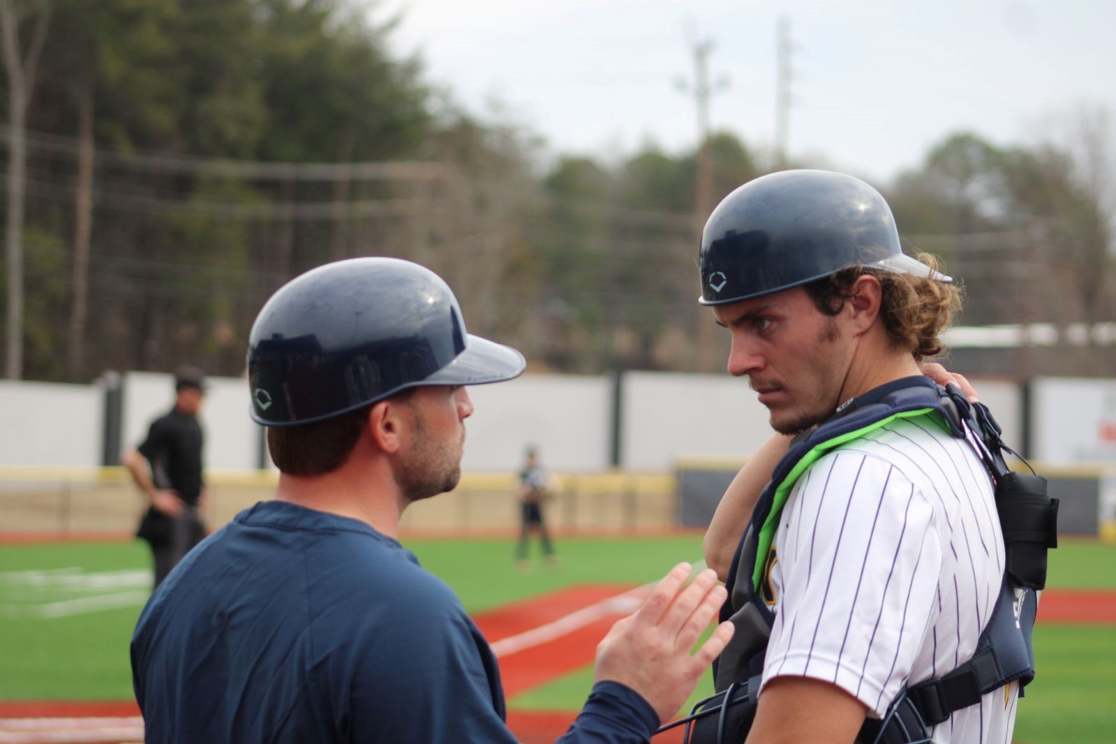 Gaston College catcher Seth Christmas, shown here talking to Rhinos assistant coach Jacob Rand, is hitting .388 with 12 home runs, 70 RBIs and 18 stolen bases this season entering the Region 10 tournament.