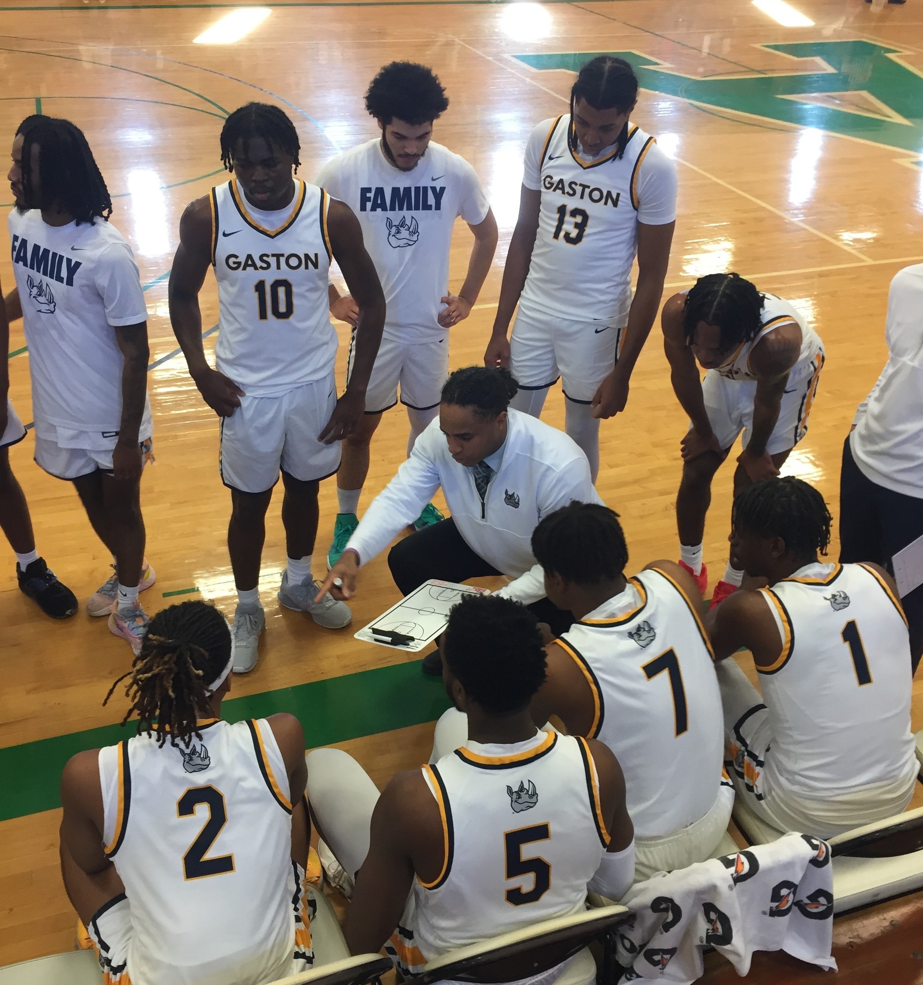 Gaston College interim head basketball Jermaine Williams (center) and his team during a game earlier this season.