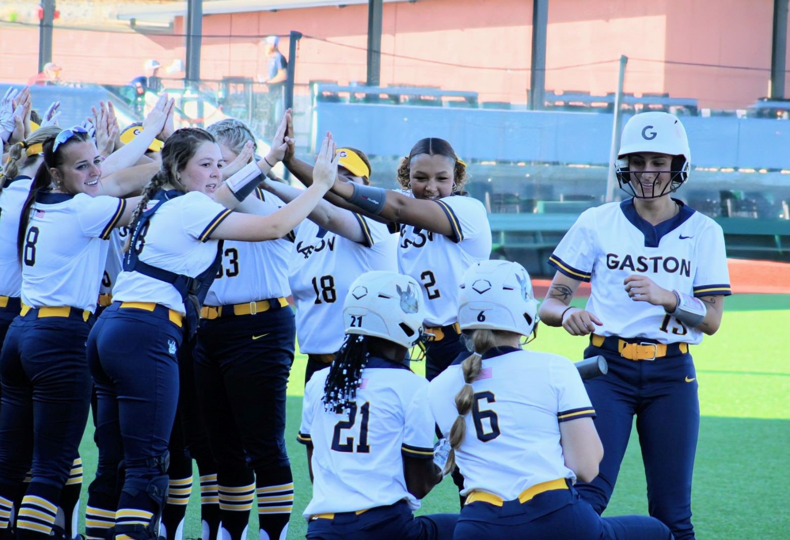 After Dakota Marshall (far right) hit her first college home run, her Gaston College teammates celebrate at home plate.