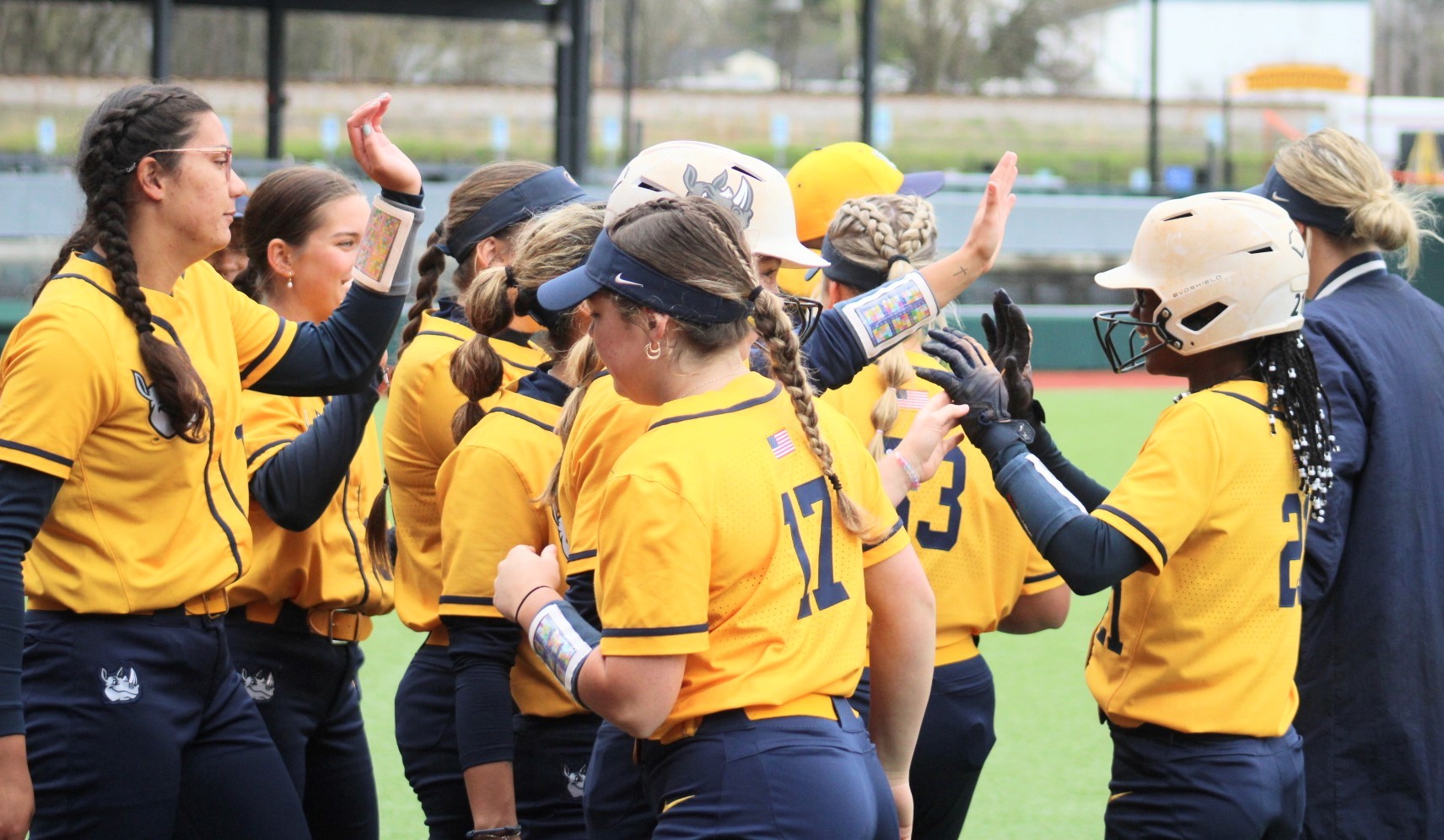 Gaston College softball team celebrates a home run by sophomore outfielder Gabrielle Porterfield (far right) during a game at Gastonia's CaroMont Health Park.