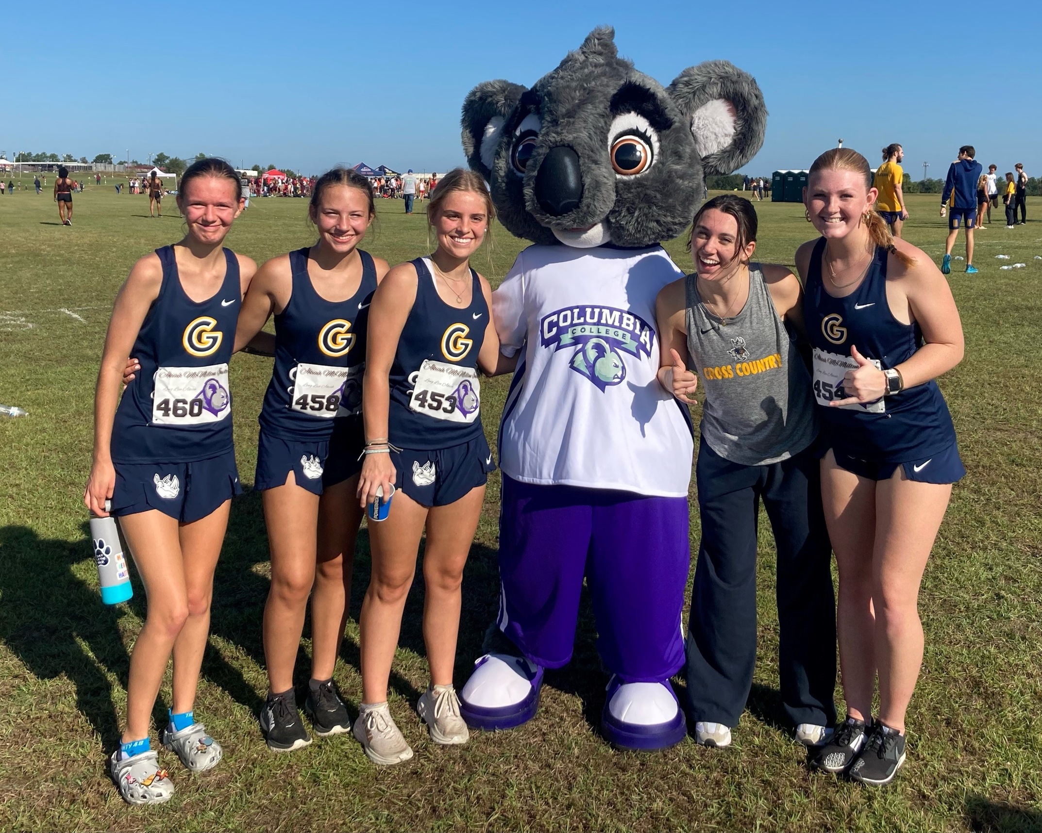 Gaston College cross country team members pose for a photo with Columbia, S.C., College's "Koala" mascot at Saturday's Akiah McMillan Invitational.